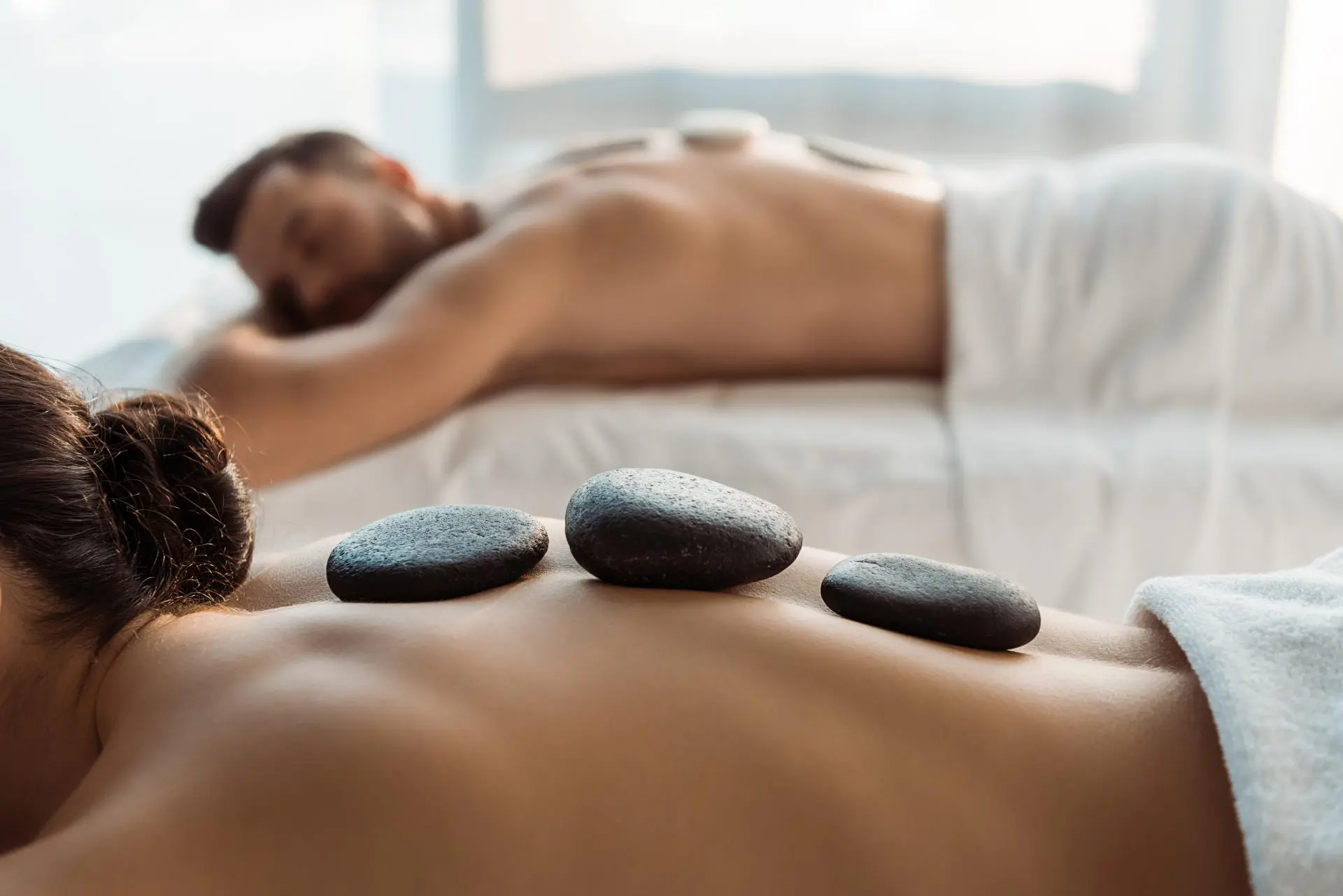 A calming hot stone massage treatment for deep relaxation at Stanford Massage Wellness Beauty, a Beauty And Wellness Store in Menlo Park